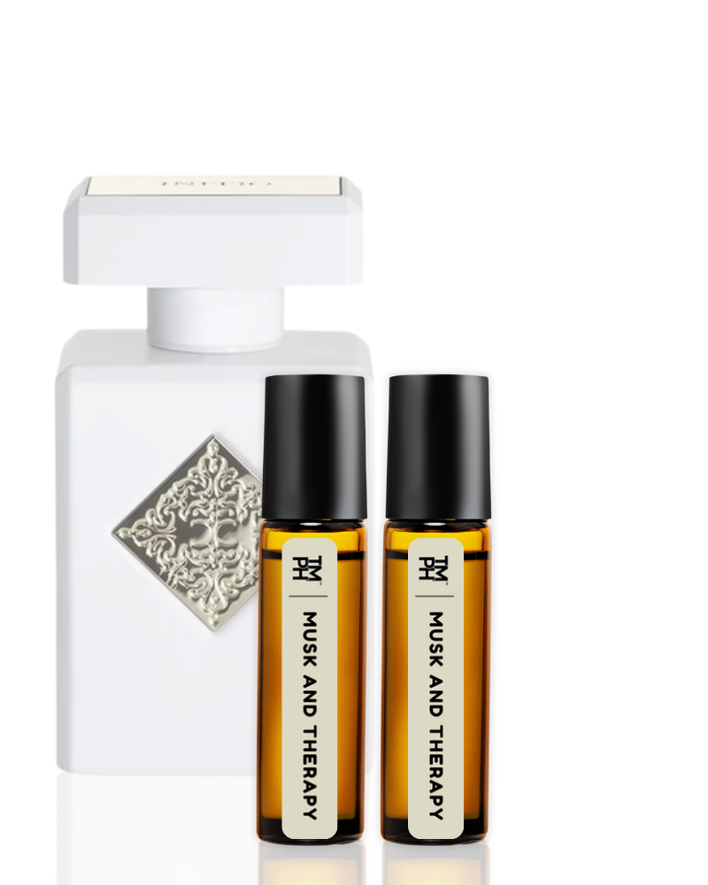 White perfume bottle and two brown roller bottles labeled 'Musk and Therapy' on a white background