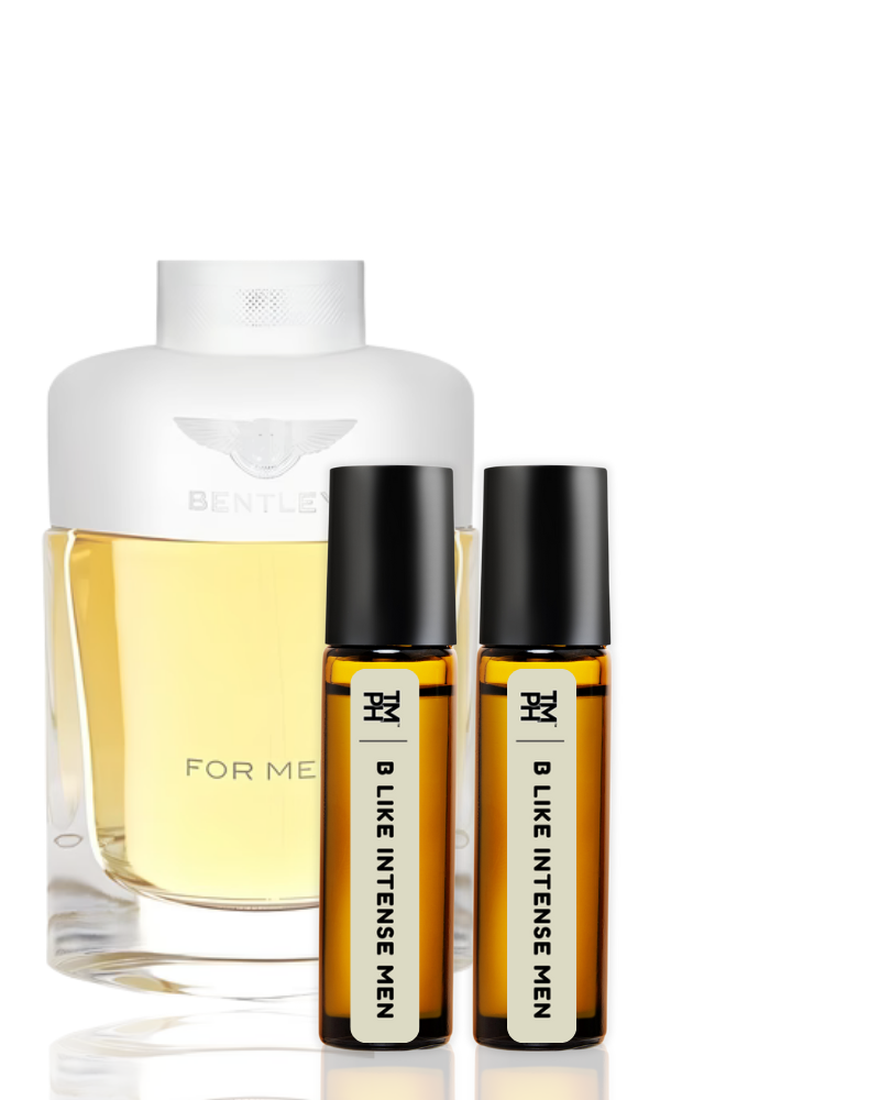 Perfume bottle and two rollerball bottles on a white background