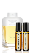 Perfume bottle and two rollerball bottles on a white background