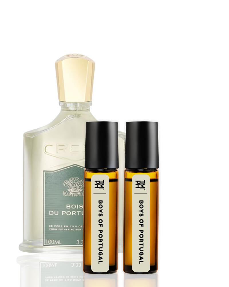 Set of perfume bottles including a large bottle and two smaller rollerball bottles on a white background