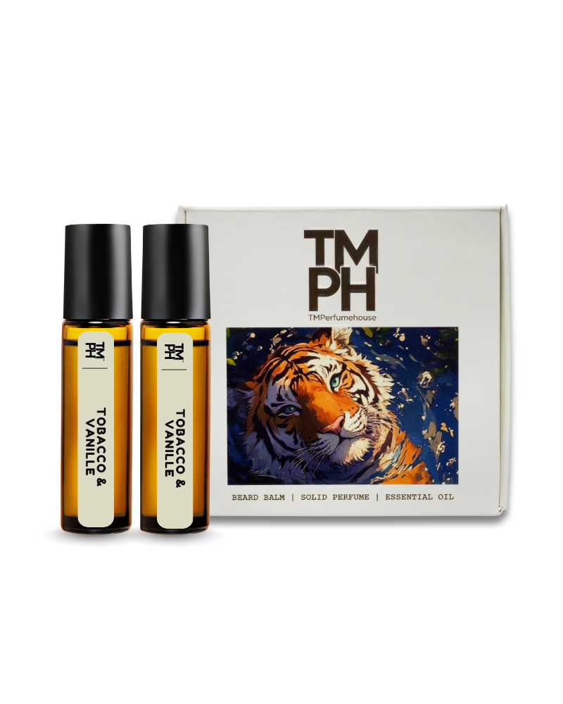 Two bottles of 'Tobacco & Vanille' solid perfume with a box featuring a tiger illustration on a white background.