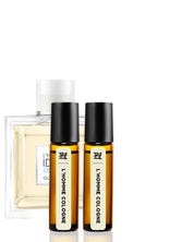 Two small bottles of L'Homme Colgene cologne with a larger bottle in the background on a white background