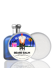 Blue bottle and white container of Tim Phillips Beard Balm on a white background