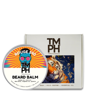 Beard balm container with colorful label and packaging featuring a tiger design.