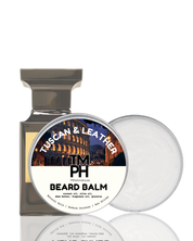 Beard balm packaging with 'Tuscan & Leather' scent on a white background