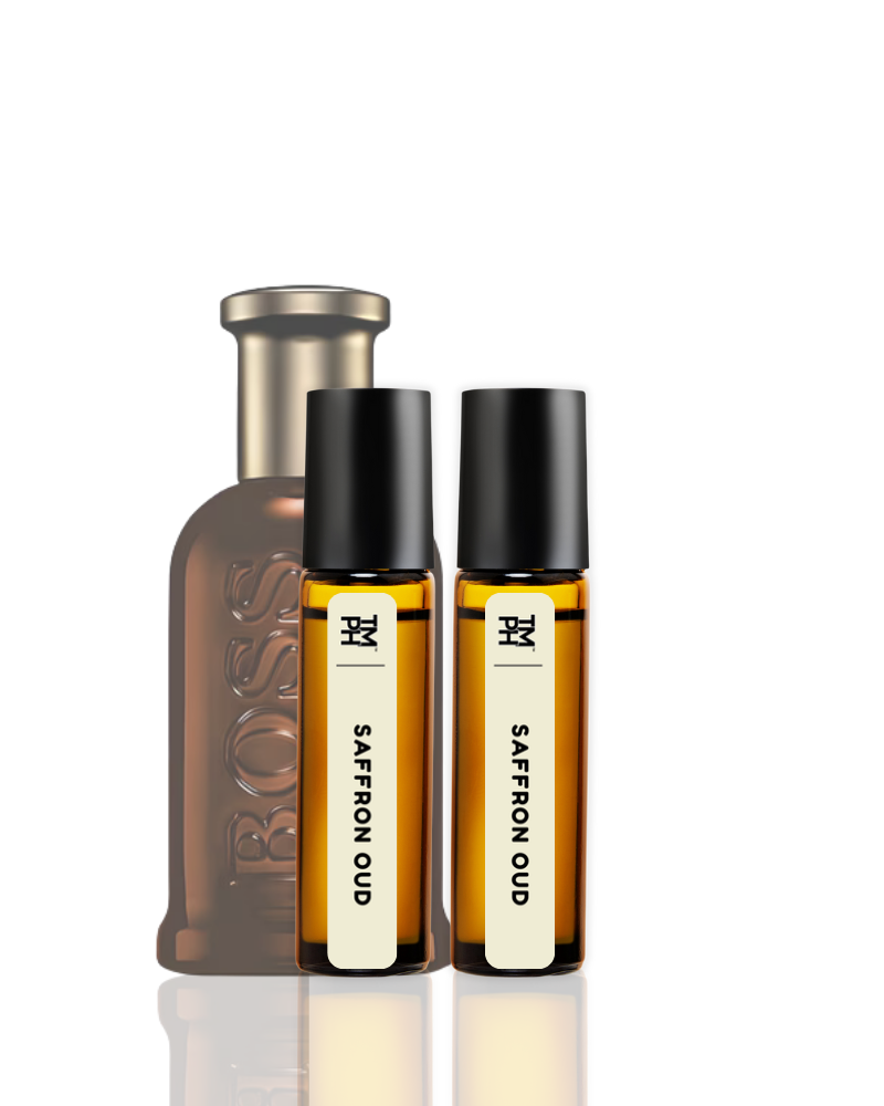 Two bottles of 'Saffron Oud' perfume with a larger bottle in the background.